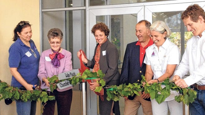 The ribbon is cut at the opening of the Frances Archbold Hufty Learning Center and Adrian Archbold Lodge at Archbold Biological Station in South Central Florida. From left: Debbie Upp, executive assistant to the executive director; Barbara Stewart, Highlands County commissioner; Mary Hufty, chairwoman of the board of Archbold Expeditions; Danial Alegria, president of the board; Hilary Swain, executive director; and Carlton Ward, photojournalist and Archbold colleague.