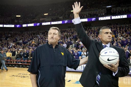 Kansas State coach Frank Martin (right) and his coaching mentor, Bob Huggins of West Virginia, acknowledged the response of the crowd in Wichita's Intrust Bank Arena prior to Thursday's game. The fans got everything they wanted, except for a K-State victory, in an 85-80 game that extended into double overtime.