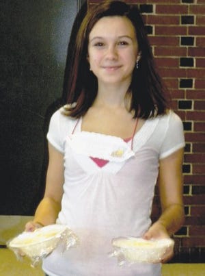 Danielle Bissonnette serves pancakes to raise money for Ginny’s.