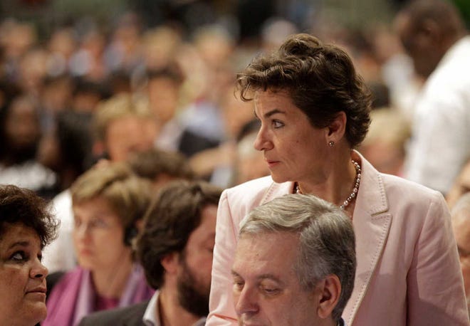 U.N. climate official Christiana Figueres, right, talks with delegates at the climate change summit as it nears its end in the city of Durban, South Africa, on Saturday. Some ministers and top climate negotiators left Durban without an agreement Saturday, with time running out and the prospect of an inconclusive end jeopardizing new momentum in the fight against global warming.