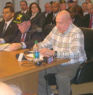 Paul DeMaio of Plymouth testifies during a veterans hearing at Quincy City Hall on Monday, Dec. 12, 2011.