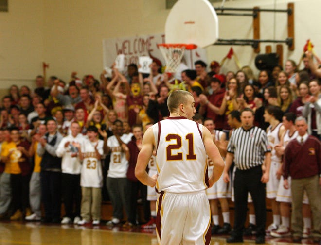 The crowd goes wild for Cardinal Spellman High School's Joey Glynn (21) after he scores his 1000th point during the game against Bishop Fenwick High School in Brockton on Wednesday, December 14, 2011.