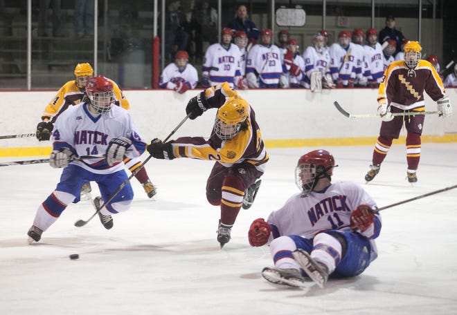 Weymouth's Tom Munichiello takes a shot in the third period of a game against Natick on Wednesday, Dec. 13, 2011.