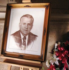 The framed drawing of John Mahan, which proudly hangs in Tata Auditorium amongst the other mayors of Leominster, is being displayed in the front lobby of City Hall, along side a sympathy wreath.