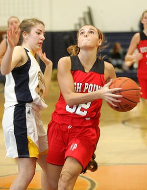 Photo by Amy Herzog/New Jersey Herald — Brianne Woop shoots during the season opener against Jefferson on Friday in Jefferson. The Wildcats won, 44-40.