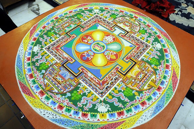Tibetan monks created this mandala from colored sand during the past week in Shrewsbury.