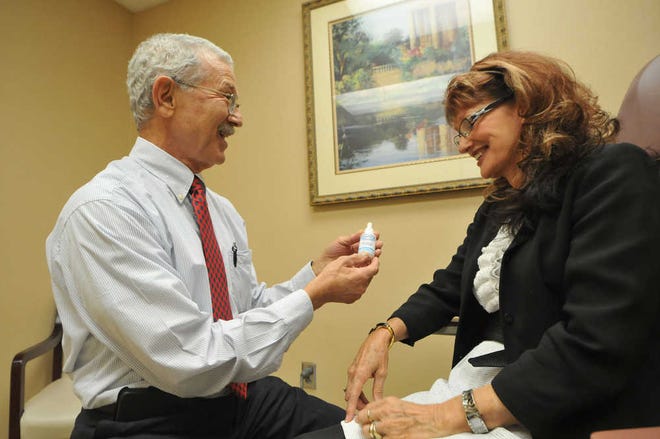 Richard Burkhart/Savannah Morning News Dr. Ron Finger talks with Shirley Ann Lamb about his New Youth Skin Treatment System in his office located at the Candler Hospital Heart and Lung Building.