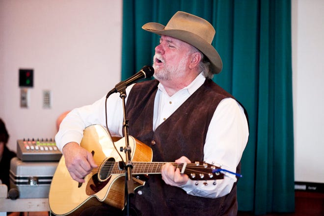 David Worth Hinton performs at the free Christmas concert at the Gateway Building on Sunday. Along with Hinton, Misty Trone also performed holiday songs for the audience.