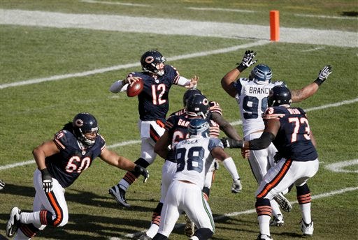 Chicago Bears quarterback Caleb Hanie (12) passes in the first half of an NFL football game against the Seattle Seahawks in Chicago, Sunday, Dec. 18, 2011.