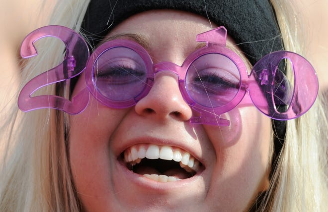Lyndzi Miller views the 2010 Polar Plunge through her New Year's glasses before she takes a dip last January in East Peoria.