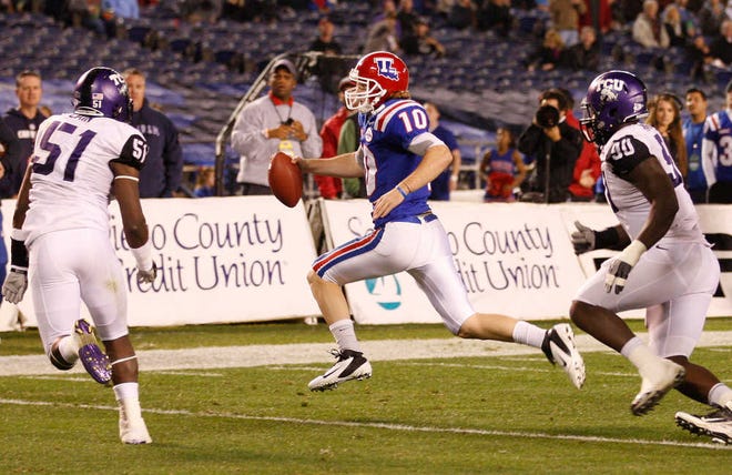 Louisiana Tech quarterback Colby Cameron tries to avoid TCU defensive end Stansly Maponga, right, and linebacker Kenny Cain during the first half of the Poinsettia Bowl game Wednesday in San Diego.