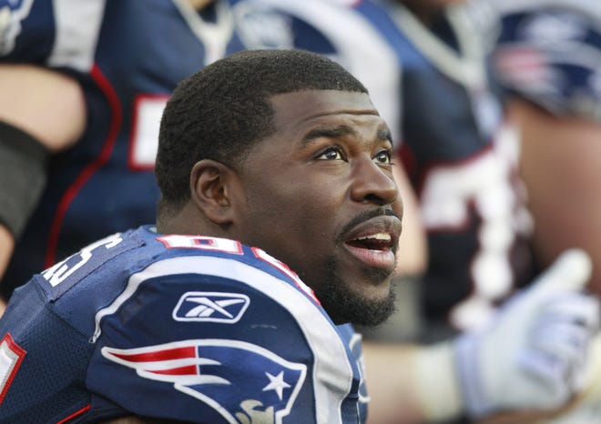 Offensive lineman Donald Thomas watches from the bench during an NFL football game against the Indianapolis Colts in Foxborough, Mass. Sunday, Dec. 4, 2011. (AP Photo/Elise Amendola)