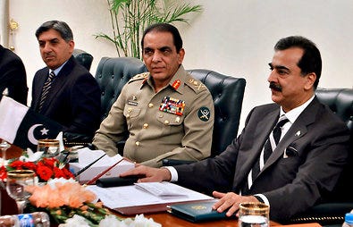 Gen. Ashfaq Parvez Kayani, center, with prime minister Yusuf Raza Gilani, right, in June. “The army will continue to support democratic process in the country,” General Kayani said.
