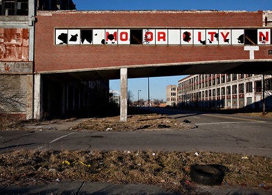 The letters on an overpass used to spell “Motor City.” Until a recent report, talk about Detroit’s economy had been hopeful.
