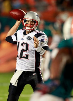 New England Patriots quarterback Tom Brady prepares to pass during the fourth quarter of an NFL football game against the Miami Dolphins, Monday, Sept. 12, 2011 in Miami. The Patriots defeated the Dolphins 38-24. (AP Photo/Wilfredo Lee)