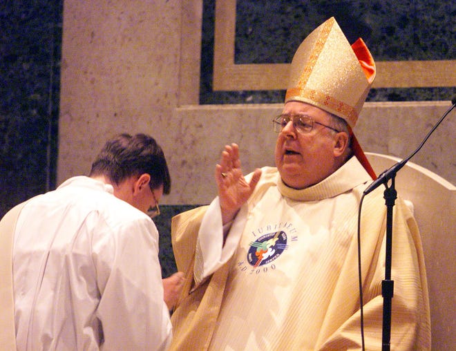 The switch from 1999 to 2000 brought many special celebrations, including a midnight New Year’s Eve Mass at the Cathedral of St. Peter in Rockford. The Most Rev. Thomas Doran, the bishop of Rockford, blessed Deacon John Fritz before reading the gospel at the Mass.