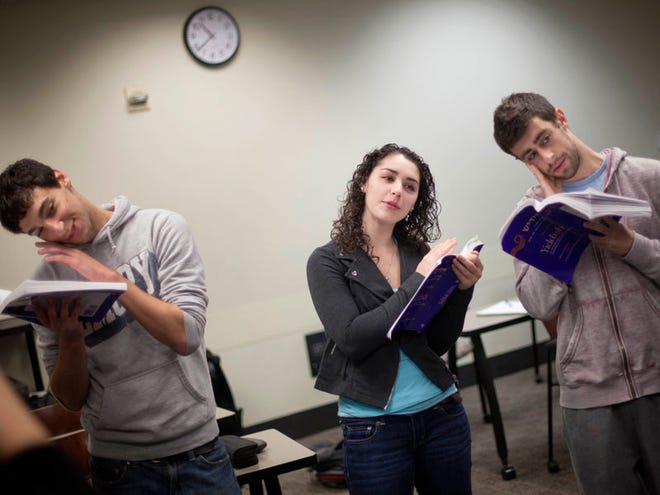 From left, Ethan Eyman, 20, Marissa Koven, 17, and Adam Wyckoff, 20, sing along during a Yiddish class at Emory University on Nov. 10 in Atlanta. The class is in its first semeseter at Emory University, and is one of a handful of such programs at colleges across the country that focuses on Germanic-based language of Eastern European Jews.