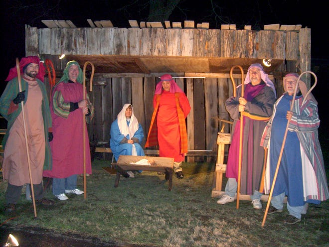 The live nativity scene at Peace Evangelical Lutheran Church on Cleveland Avenue S has been offered by the church congregation for 49 consecutive years. During the first night’s nativity scene, Mary and Joseph are portrayed by Donna and Dave Brothers. Shepherds are (left to right) Gabe Wood, Mike Jezewski, Terry Slutz and Ed Lidderdale.