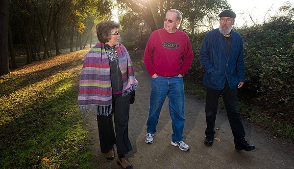 Lodi Lake docents Kathy Grant, left, Dave Mende and Jay Bell walk along a nature trail near the lake last week. They are among a number of docents honored by the City Council recently for 25 years of service to preserving the Lodi Lake Nature Area.