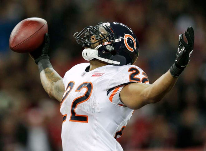 Chicago Bears running back Matt Forte celebrates his 32-yard touchdown during the first half of an NFL football game against the Tampa Bay Buccaneers Sunday, Oct. 23, 2011, at Wembley Stadium in London. (AP Photo/David J. Phillip)