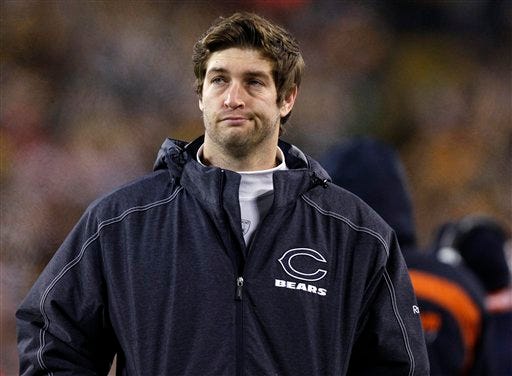 Injured Chicago Bears quarterback Jay Cutler reacts on the bench during the first half of an NFL football game against the Green Bay Packers Sunday, Dec. 25, 2011, in Green Bay, Wis. (AP Photo/Jeffrey Phelps)