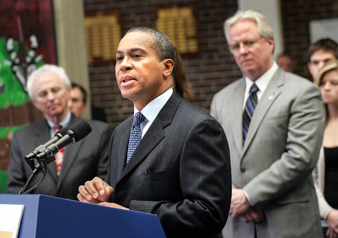 Braintree Headmaster David Swanton, right, stands with Massachusetts Gov.Deval Patrick, center, and Braintree School Superintendent  Peter
Kurzberg. Swanton plans to retire in August after 32 years as a teacher and administrator.


GREG DERR
