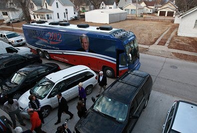 Newt Gingrich, on a campaign bus tour, stopped at a restaurant in Spencer, Iowa, on Wednesday. He again criticized negative advertisements focusing on him.