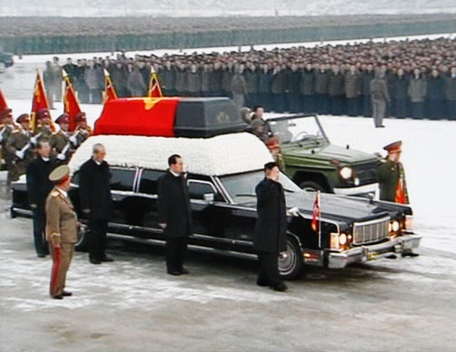 In this image made from KRT video, North Korean successor Kim Jong Un, right front, salutes as the funeral procession of late leader Kim Jong Il returned to the Kumsusan Memorial Palace in Pyongyang, North Korea Wednesday, Dec. 28, 2011. (AP Photo/KRT via APTN)