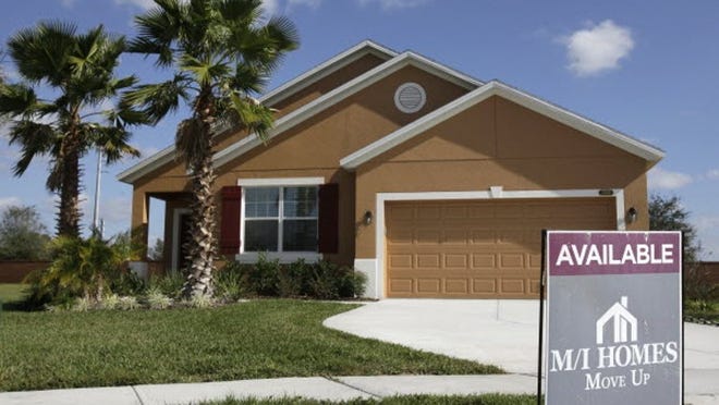This Dec. 20, 2011, shows a new home for sale in Apopka, Fla. Americans bought slightly more new homes in November, but 2011 will likely end up as the worst year for sales in history.