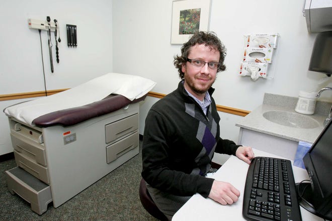 Will Holm is a licensed clinical social worker from Rosecrance who works with patients and providers at Crusader's West State Street clinic. He is pictured in his office Tuesday, Dec. 27, 2011.
