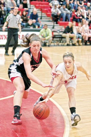 WP - 12/30/11 - Watertown's Gabriella Coppola, right, keeps the ball away from Olivia Gaither in Watertown's 68-54 victory over Winchester at home. Wicked local photo by Jared Charney.