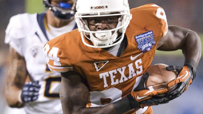 Good to go: Texas' Marquise Goodwin looks for room to run on a 37-yard gain, to set up UT's final score against California. Two runs up the gut by fullback Cody Johnson — the latter from four yards out — got the ball in the end zone.