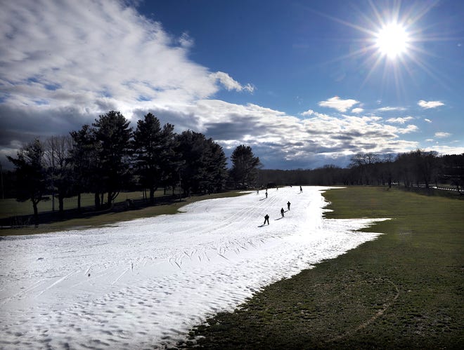Cross country skiers enjoy the Weston Ski Track on the Leo J Martin Golf Course Wednesday. Man made snow was created Christmas Day on what in summertime is the par three 5th hole.