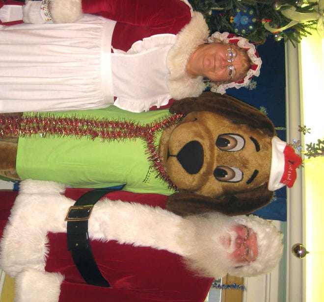 Courtesy of Beth Logan Henry the Hospice Hound with Santa and Mrs. Claus at the Bryan County Health and Rehabilitation Center.