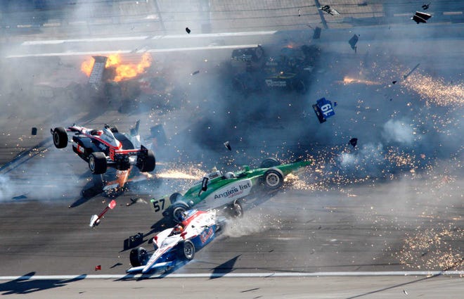 Drivers crash during a wreck that involved 15 cars and claimed the life of Dan Wheldon during the IndyCar Series race in October in Las Vegas.