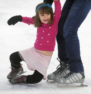 Astrid Yohay, 5, of New York City, is all smiles as she falls down while ice skating in Brockton. She is visiting her grandmother Pat Jacobsen of Easton this week.