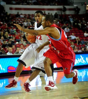 AJ Reynolds/onlineathens Georgia's Gerald Robinson rushes past Delaware State's Jabari Joyner during the December 30, 2011 game between the Georgia Bulldogs and the Delaware State Hornets at the Stegeman Coliseum.