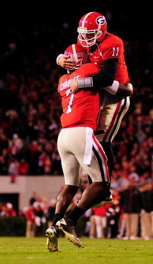 Georgia Bulldogs quarterback Aaron Murray (11) celebrates with tight end Orson Charles (7) after Murray's 32-yard touchdown pass to Charles as the Georgia Bulldogs beat the Georgia Tech Yellow Jackets 42-34 in an NCAA football game at Sanford Stadium on Saturday, November 27, 2010 in Athens, Ga. (David Manning/Staff/david.manning@onlineathens.com)