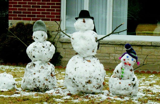 Snowmen have cropped up in the Straits region, following Thursday’s snowfall — including a trio of figures surrounded by melting snow on State Street (bottom). Send the Daily Tribune your snow decorations pictures at zbritton@ cheboygantribune.com