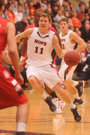 Hope's David Krombeen (11) drives to the basket against Indiana Wesleyan Friday night at DeVos Fieldhouse.