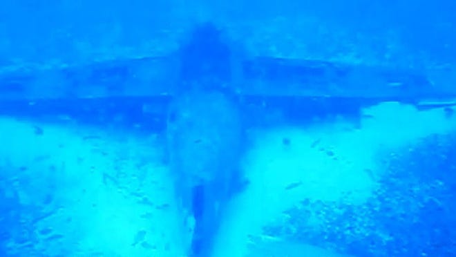 This mostly intact aircraft upside down on the ocean floor was found by divers about 4 miles off Jupiter. A World War II veteran thought it might the plane he was aboard that ditched in 1943.