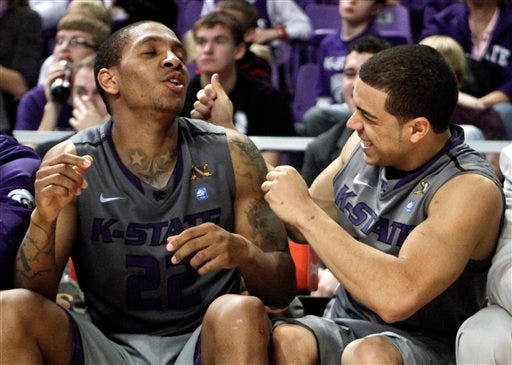 Kansas State starters Rodney McGruder (22) and Angel Rodriguez had plenty of time to react happily to the play of their teammates as they watched the Wildcats' 82-46 Saturday romp over Howard from the bench during much of the second half.