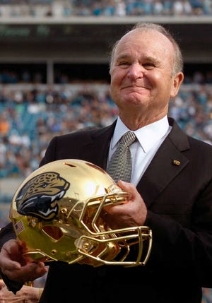 Jacksonville Jaguars owner Wayne Weaver smiles at the crowd after being honored at half time during an NFL football game against the Indianapolis Colts, Sunday, Jan. 1, 2012, in Jacksonville, Fla. (AP Photo/Stephen Morton)