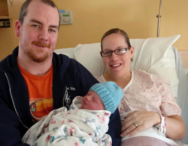 John Huff/ Staff Photographer

Patrick and Nicole Kinneavy hold their newborn son Liam James who was the first baby born at Frisbie Memorial Hospital in 2012.