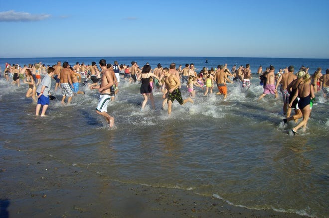 More than 200 people took part in the 14th annual Humarock Hurricane Plunge at Humarock Beach in Scituate on Sunday.