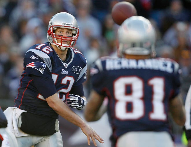 Quarterback Tom Brady completes a pass to tight end Aaron Hernandez in the second quarter of the Patriots' 49-21 victory over the Buffalo Bills on Sunday in the regular-season finale at Gillette Stadium.