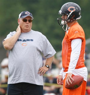 Chicago Bears offensive coordinator Mike Martz, left, talks to quarterback Jay Cutler during the NFL football team's training camp at Olivet Nazarene University in Bourbonnais, Ill., Friday, July 30, 2010. (AP Photo/Nam Y. Huh)