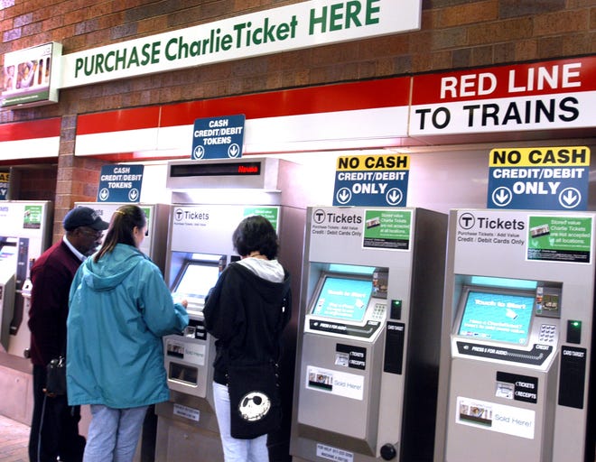 T riders buy Charlie cards at the Quincy Adams T Station.
