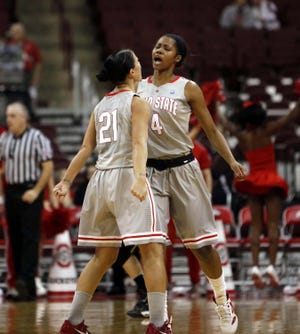 Ohio State's Samantha Prahalis (21) and Tayler Hill (4) celebrate after a play during the first half of an NCAA women's college basketball game, Monday, Jan 2, 2012, in Columbus, Ohio. No. 8 Ohio State won 84-71. Prahalis scored 30 points and Hill added 28.