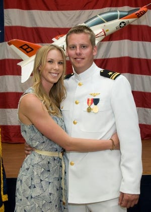 This 2011 photo provided by the Reis family shows Karen Reis, left, and her brother David Reis at his winging ceremony for the Navy. The Reis siblings were among the four people found dead in a New Year's Day shooting at a condominium in a toney neighborhood on San Diego Bay, the victims' father said Monday, Jan. 2, 2012. David Reis, 25, was an aviator in training at Marine Corps Air Station Miramar since September, and his sister was a girls volleyball coach and worked at a grocery store. (AP Photo/Reis Family Photo)